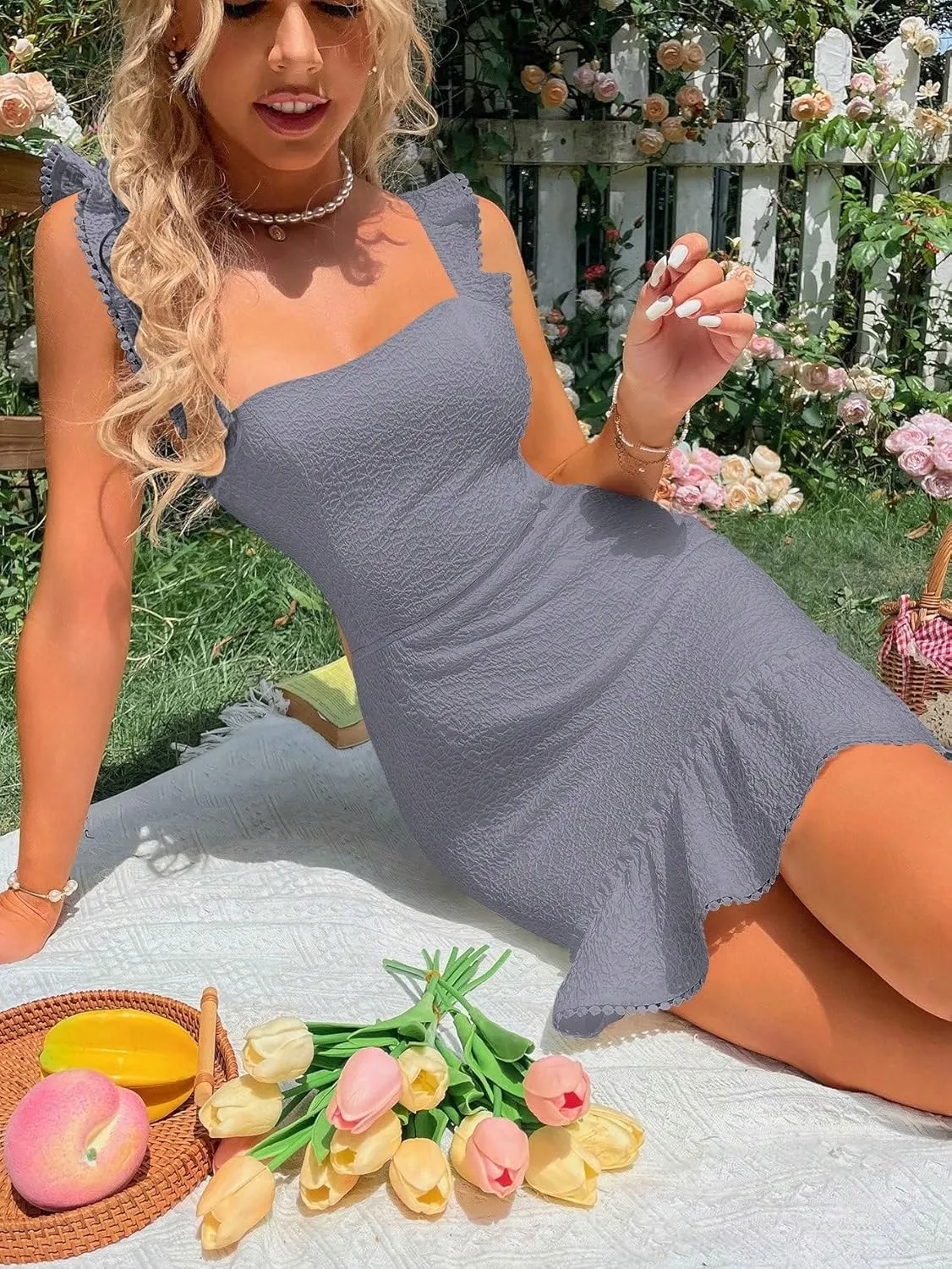 WDIRARA Women's Boho Backless Knot Ruffle Hem High Waist Trim Textured Mini Dress